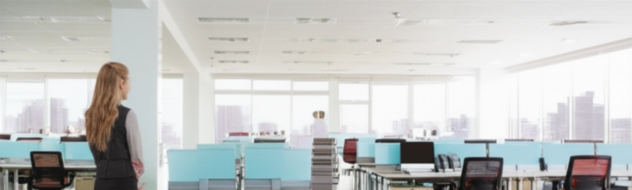 A modern, newly organized open-plan office, with perfectly arranged desks and furniture, ready for business after a corporate relocation.